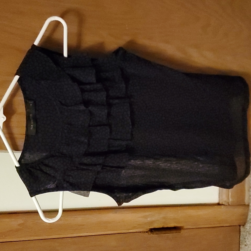 The limited size xs purple amd black tank top.